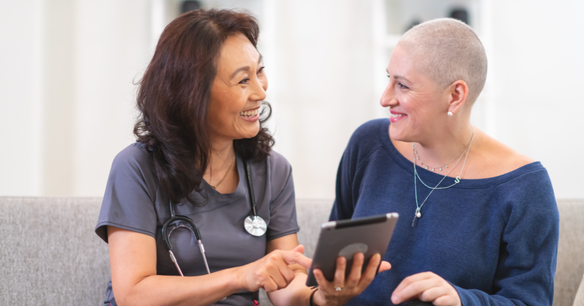 A doctor with a woman in the woman's home.