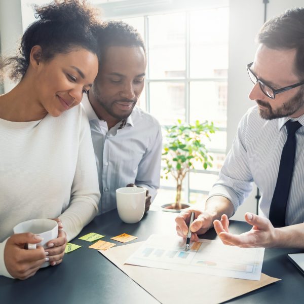 Family couple consultations with a lawyer or insurance agent. Law and insurance.
